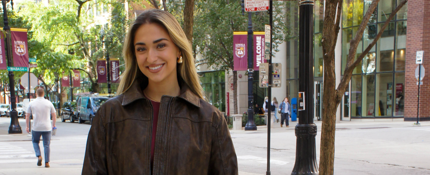 Vanesa Hoxha stands outside Loyola’s School of Communication at the Water Tower Campus.